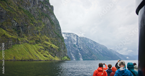 Tourists enjoying scenic nærøyfjord cruise in norway