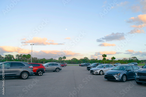 Selective focus car parked at parking lot. Used car for sale and rental service. Car insurance background. Automobile parking area. Car dealership and dealer agent Miami