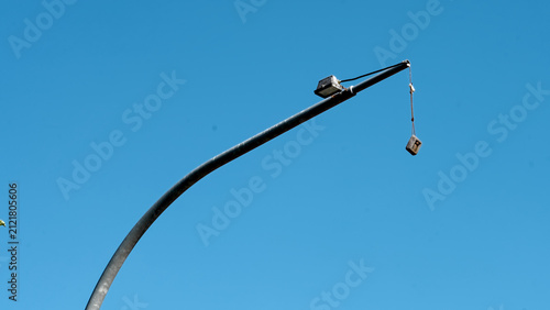 Bild auf Leinwand Street lamp under clear blue sky with diving weight hanging down