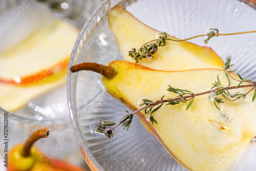 Pear elderflower spritz cocktail with thyme and ice