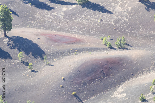 Fotografie Red volcanic cinder deposits in Painted Dunes viewed from Cinder Cone Lassen Vol