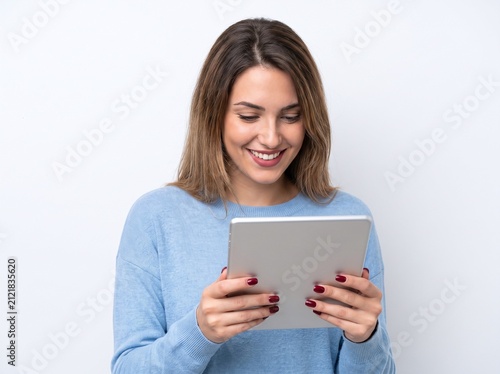 Beautiful smiling woman holding a tablet computer