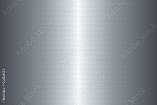 Brushed silver metal background with central reflection