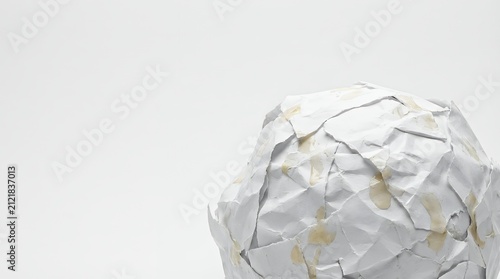 An abstract image of a poorly glued crumpled white paper object representing imperfection mistakes or the messy process of creation and experimentation. abstract object badly glued white paper