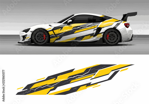 White sports car with yellow black racing decals on road