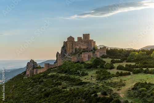 Картината върху платно Loarre Castle on a rocky ridge at golden hour in Aragon