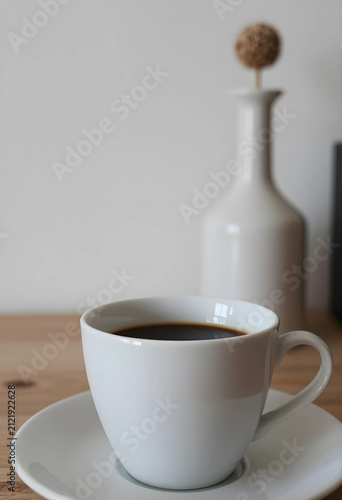 White ceramic coffee cup wi...