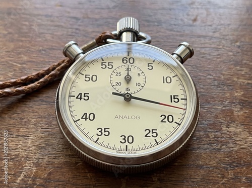 Antique silver pocket watch with intricate details, classic vintage timekeeping concept.