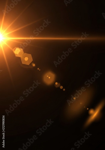 Abstract Lens Flare Light Effect on Dark Background.