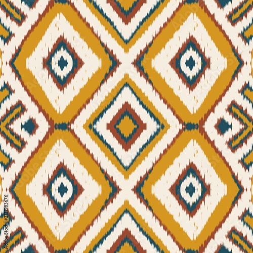 Seamless ethnic ikat pattern with bold yellow, teal blue, and terracotta geometric diamond motifs on an ivory background. Tribal fabric design perfect for bohemian prints, wallpaper, and decor.