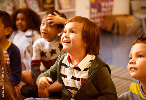 Obraz na płótnie Diverse children engaged in a joyful classroom activity