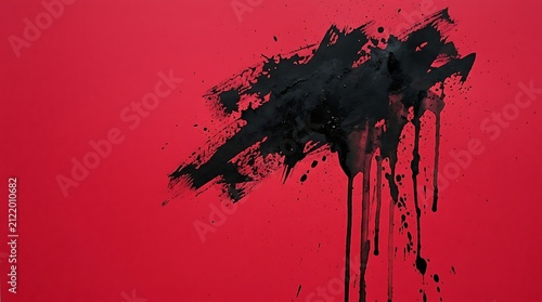 Black ink splatter on vibrant red background. Abstract paint explosion with dramatic dripping effect for creative designs.