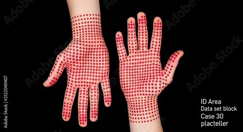Two human hands marked with a red grid pattern against a black background