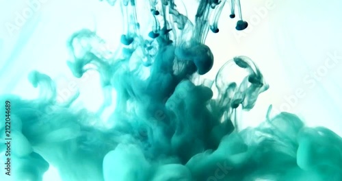 Vibrant Teal Ink Cloud Mixing Slowly in Clear Water Abstract Background.