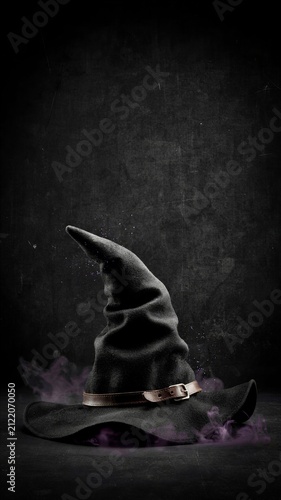 Mystical Black Witch Hat with Purple Magic Smoke on Dark Grunge Background