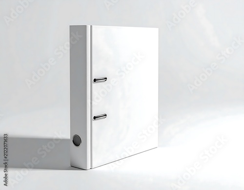White office binder with metal rings on gray background.