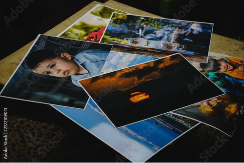 Photography Stack of printed photographs on a table