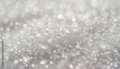 Translucent and angular white quartz grains catching bright sunlight, creating thousands of miniature starbursts and shimmering highlights. Shallow depth of field, luxury style