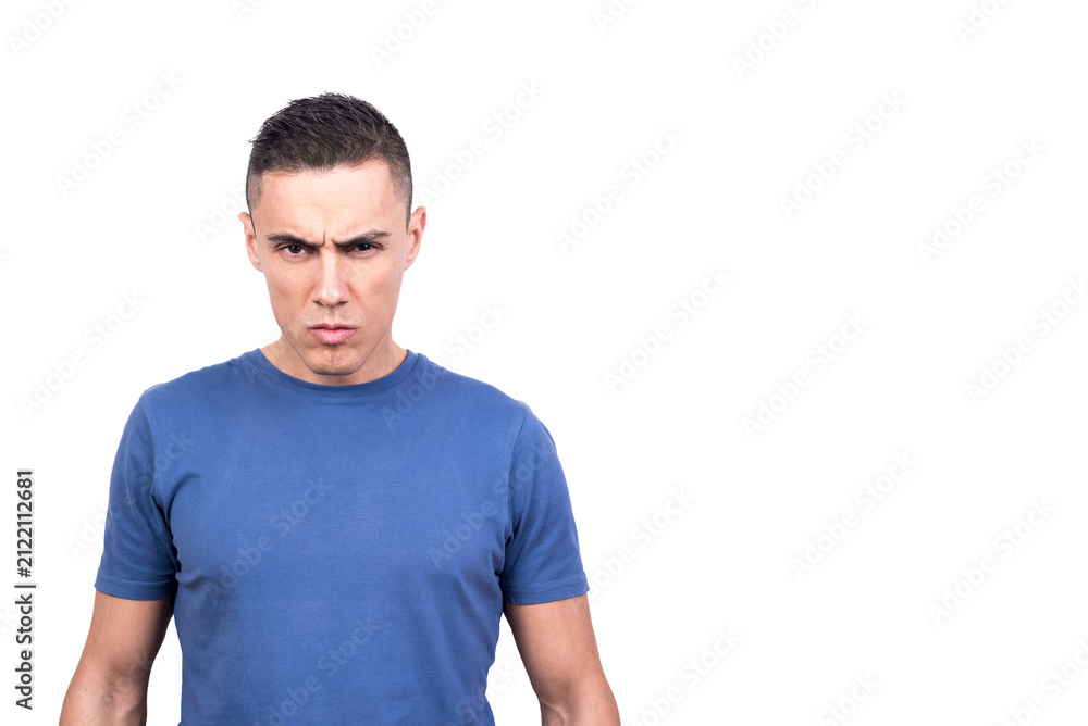 Obraz premium Man standing looking at camera with serious and confrontational expression