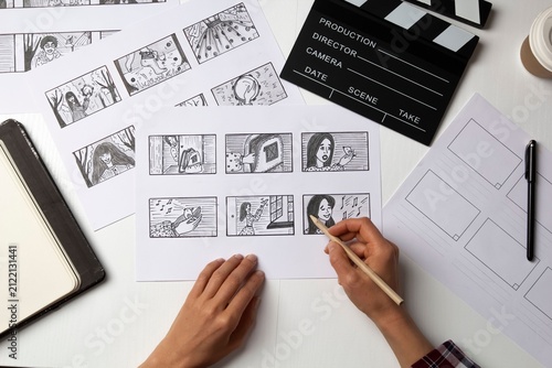 Fotografie Creative film editing process with storyboard and clapperboard
