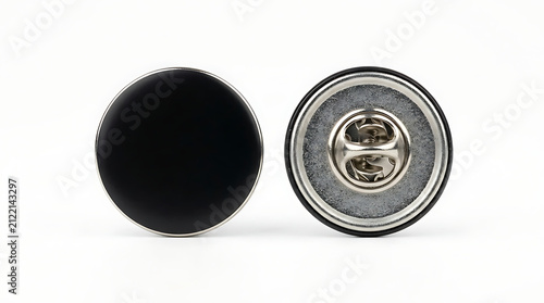 Two black enamel buttons side by side with silver pin backing