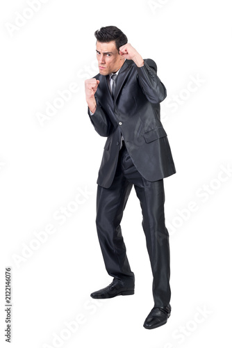 Businessman in suit standing in fighting stance