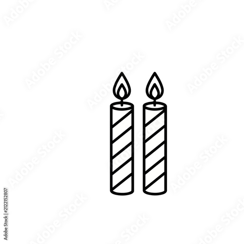 Two lit candles with diagonal stripes