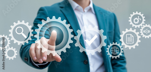 Corporate specialist optimizing business processes with digital gear icons.