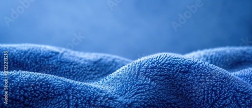 Blue terrycloth towel texture with soft wave folds