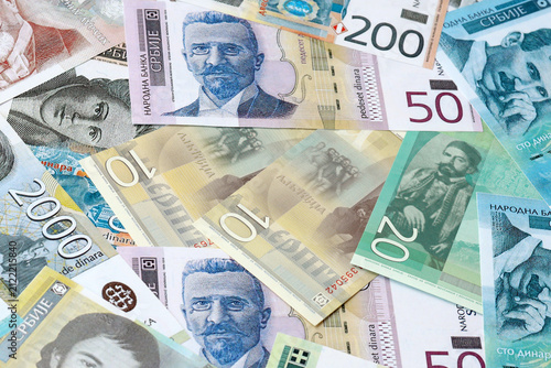 Serbian dinar money bills in pile on table. Serbia RSD currency cash close up