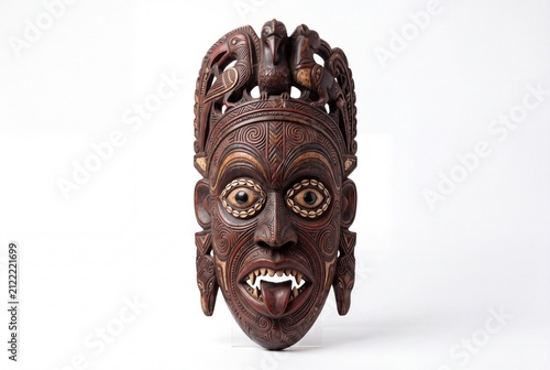 Intricately Carved Wooden Tribal Mask Featuring Animal Motifs and Detailed Facial Expressions.