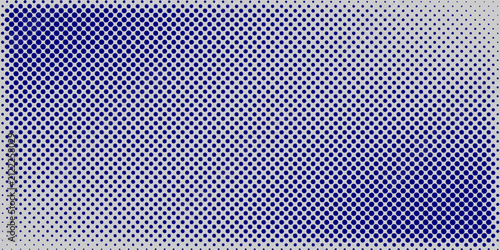Abstract blue halftone dot gradient background on light grey