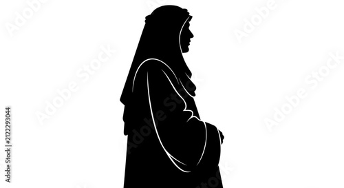 фотографія Silhouette of a Woman Wearing a Hijab in Profile View.