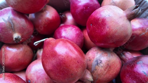 Ripe Pomegranates Falling in Slow Motion , close up