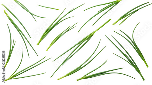 Fresh green chives scattered randomly on a clean white background, showcasing their vibrant color and slender form.