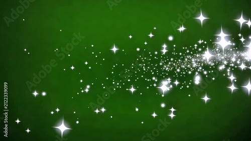 Sparkling dust trails forming abstract glowing circles against a dark green background with cinematic motion