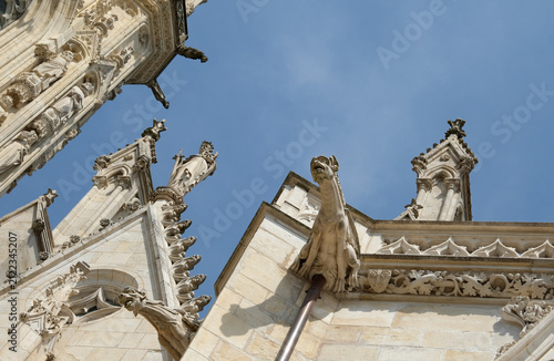 Gargoyles and statues on the top of the Nevers cathedral in France