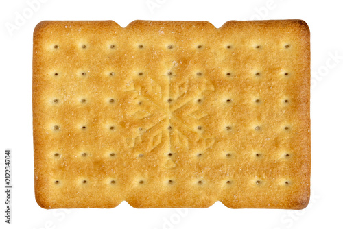 Golden baked cracker surface with embossed snowflake pattern texture