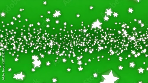 Sparkling white particles drift across a green screen background with cinematic motion