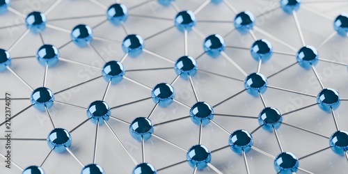 Network of connected blue spheres on white background, social or business network or technology concept, selective focus