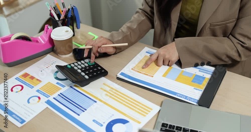 Businesswoman presenting financial reports and performance charts during business meeting, explaining data analysis, company results and strategic planning for finance, management and corporate growth