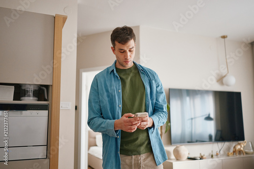 Man using phone at home 