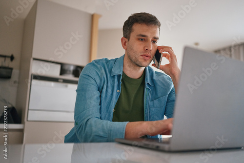 Man working on laptop at home