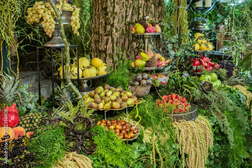 Luxury tropical fruit buffet with rustic woodland decorations