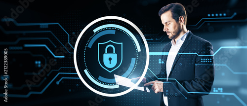 Cybersecurity specialist using a digital shield and lock interface, protecting data, networks, privacy, and secure business systems online.