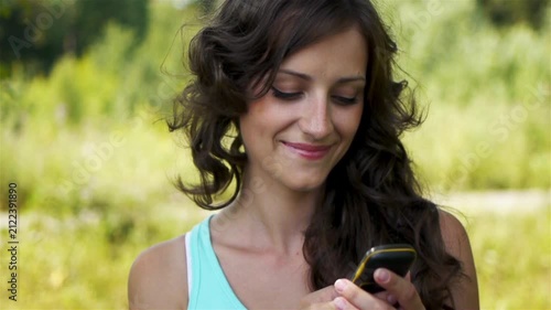 woman reads message to mobile phone