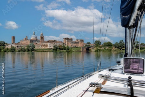 Sailing on mincio river viewing mantua skyline