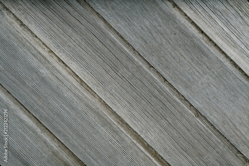 Old natural diagonal wood planks textured background, grey color