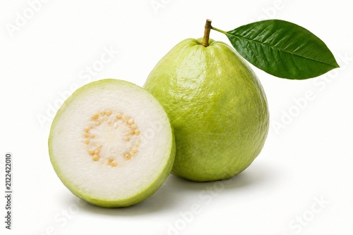 Fresh white guava fruit with green leaf and half slice isolated on a white background. Organic tropical fruit rich in vitamin C, perfect for healthy eating, juice, and dessert concept.