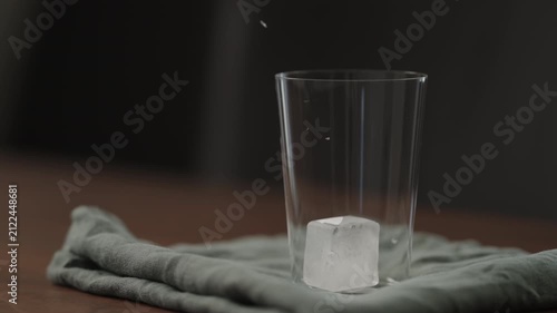 Slow motion making ice latte at home closeup shot